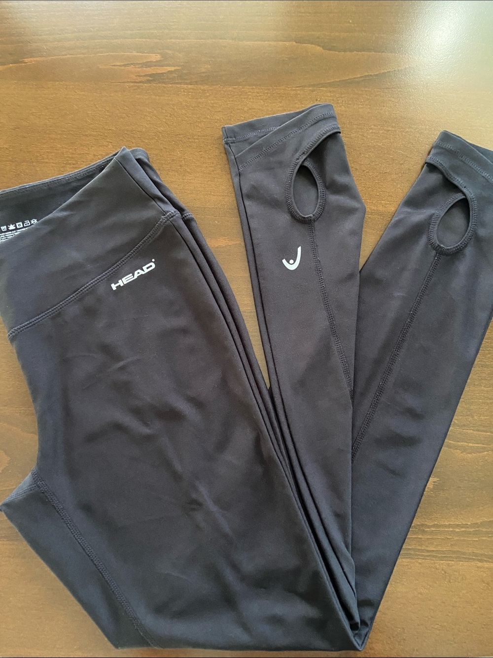 Women’s Black Performance Stirrup Leggings. Head brand, size Small